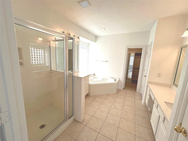 6731 Pinetop Glen Ln, Spring, TX 77379 - full bath featuring plenty of natural light, vanity, a stall shower, and tile patterned flooring