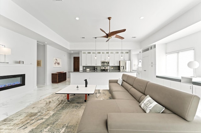 living room with ceiling fan