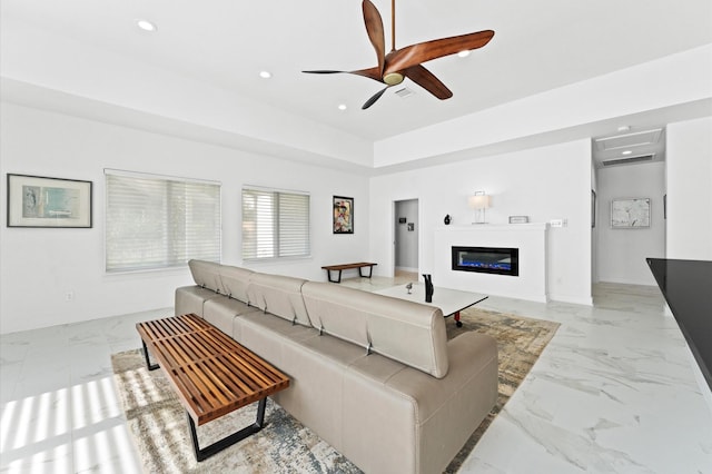 living room featuring ceiling fan and a wall unit AC