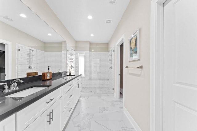 bathroom with vanity and a shower with shower door