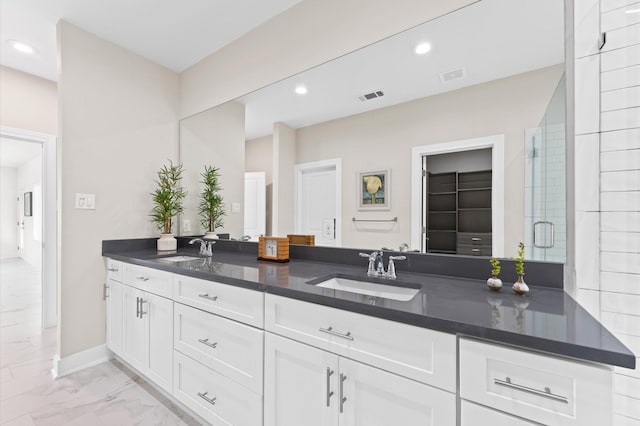 bathroom with vanity and walk in shower