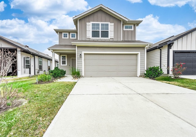 view of front of home featuring a garage and a front lawn