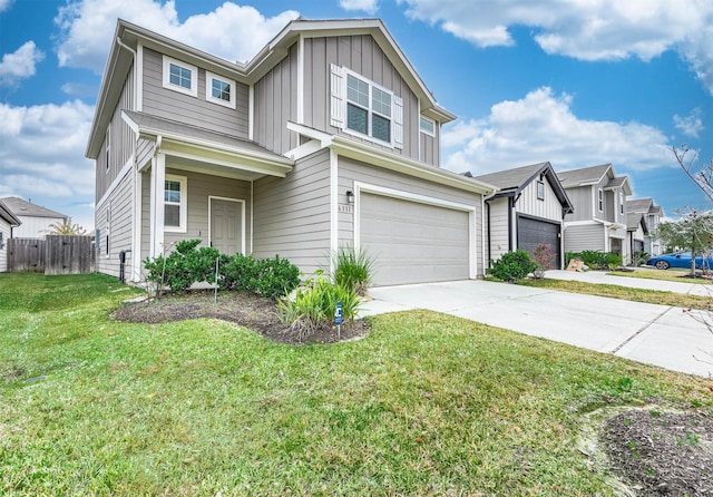 view of front of property with a garage and a front yard