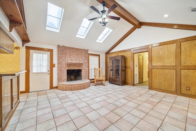 21514 Lee Rd, Humble, TX 77338 - unfurnished living room with light tile patterned floors, visible vents, a ceiling fan, vaulted ceiling with beams, and a fireplace