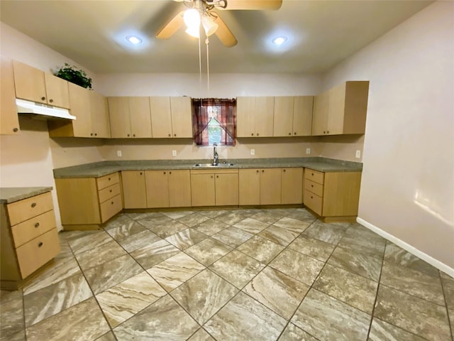 kitchen featuring sink, light brown cabinets, and ceiling fan