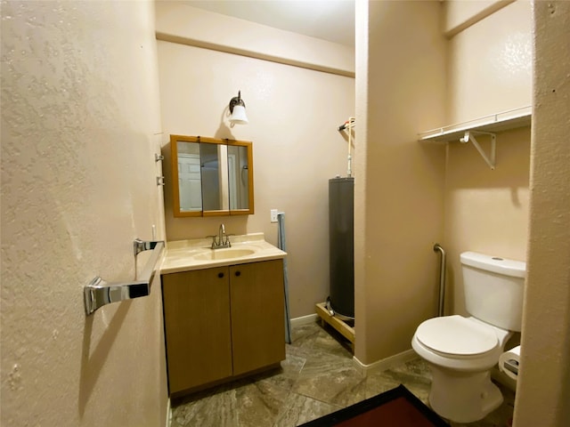 bathroom with toilet, vanity, and water heater