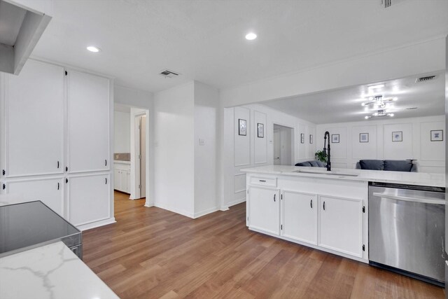 kitchen featuring sink, white cabinetry, light hardwood / wood-style flooring, and stainless steel appliances