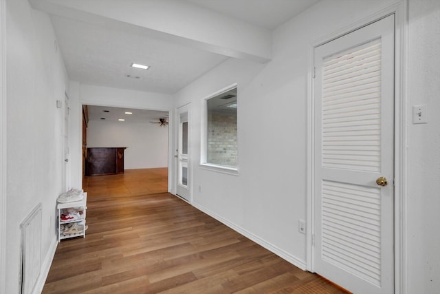 hall with hardwood / wood-style floors