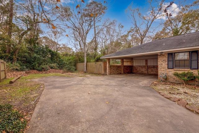 view of side of property featuring a carport