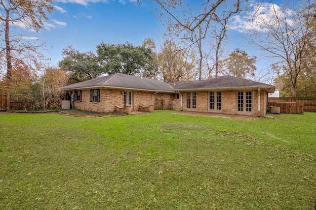 rear view of house with a lawn