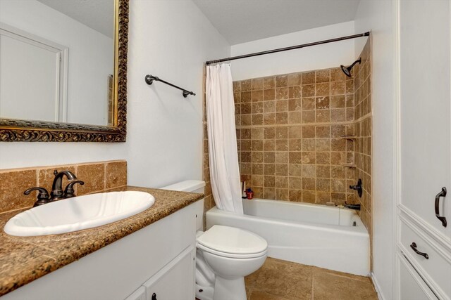 full bathroom featuring shower / bath combo with shower curtain, toilet, vanity, and tile patterned flooring