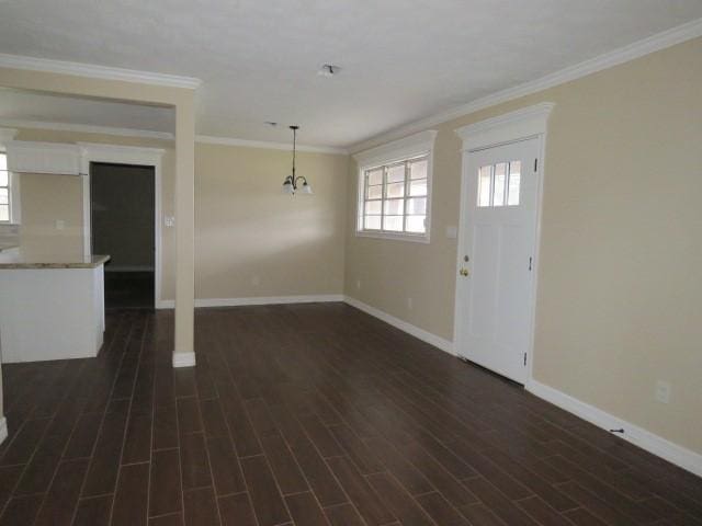 interior space featuring crown molding and dark hardwood / wood-style flooring