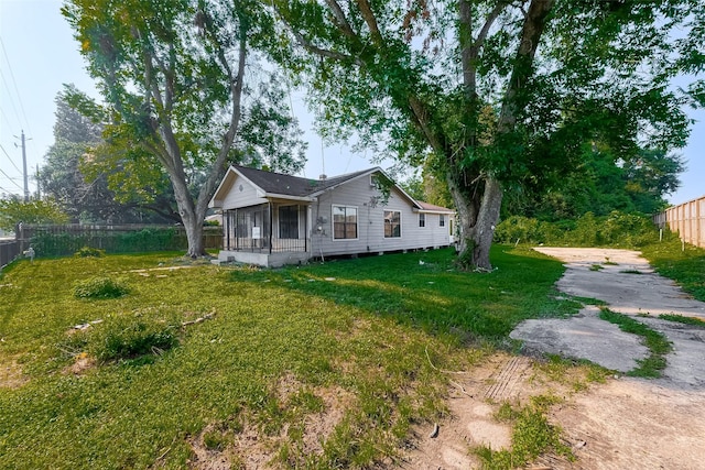 exterior space with a porch and a lawn