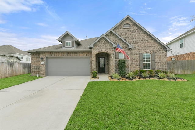 view of front of home with a garage and a front lawn