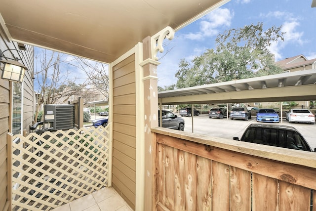 view of patio / terrace with a carport and central AC