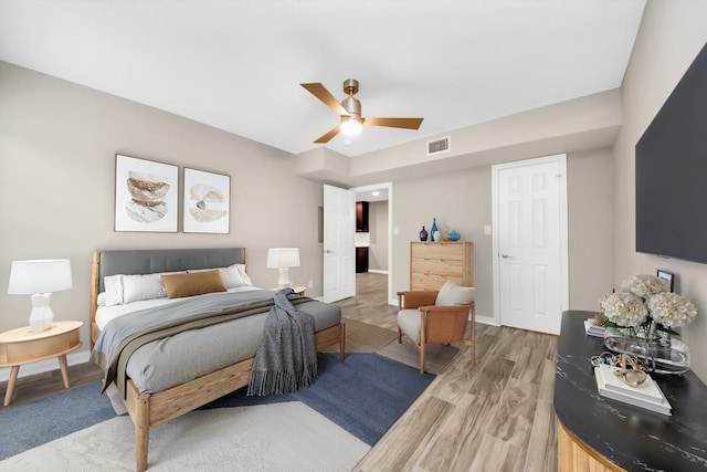 bedroom featuring wood-type flooring and ceiling fan