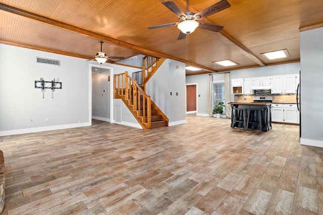 unfurnished living room with wooden ceiling, light hardwood / wood-style floors, and ceiling fan