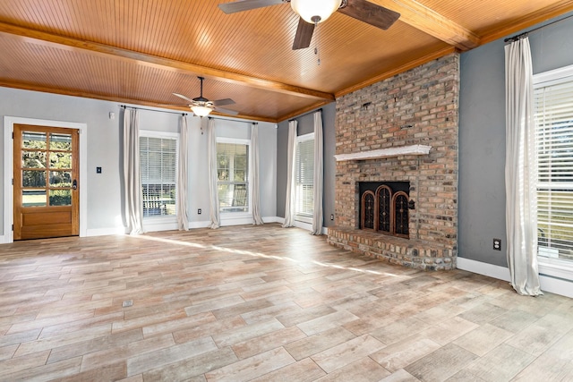 unfurnished living room with a brick fireplace, wooden ceiling, beam ceiling, and ceiling fan