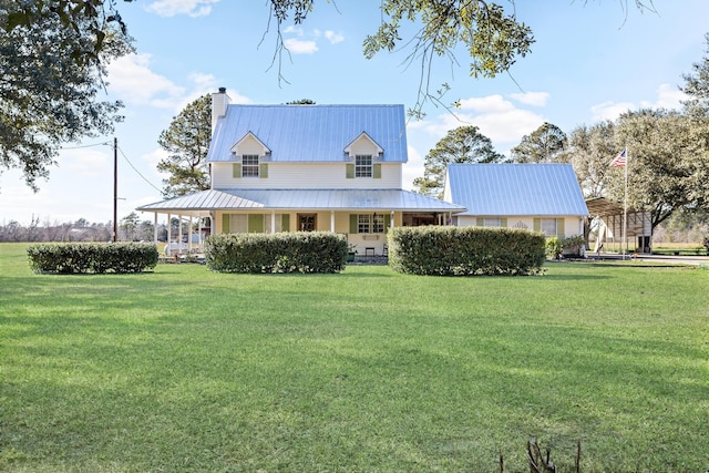 view of front of home featuring covered porch and a front yard