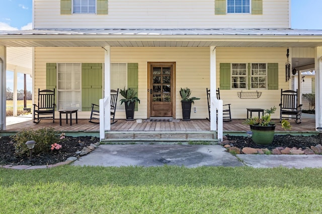 doorway to property with a porch