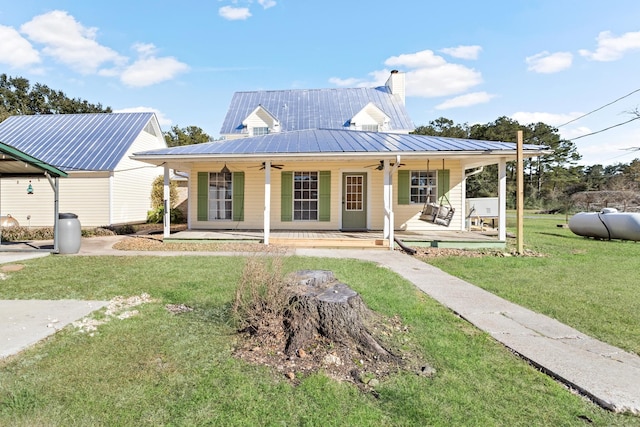 view of front of property with a porch, a front yard, and ceiling fan