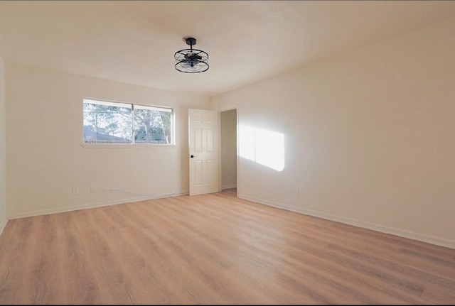 unfurnished room with light hardwood / wood-style floors