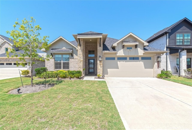 view of front facade with a garage and a front lawn