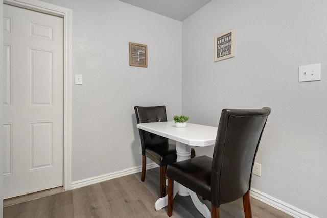 dining room with dark wood-type flooring