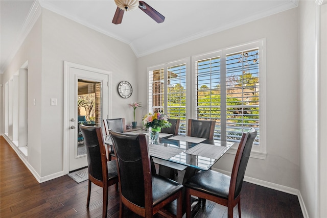 dining area featuring ceiling fan, dark hardwood / wood-style floors, crown molding, and vaulted ceiling