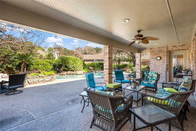 view of patio with an outdoor living space and ceiling fan