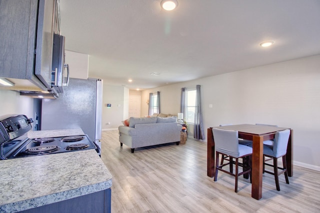 dining room featuring light wood-type flooring