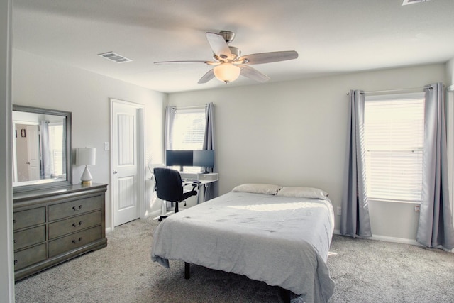 bedroom with light colored carpet and ceiling fan