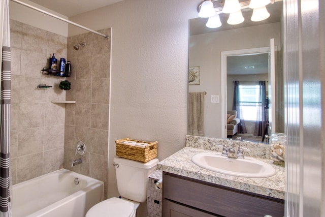 full bathroom with shower / bath combo with shower curtain, toilet, and vanity