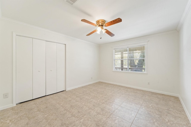 unfurnished bedroom featuring ceiling fan, visible vents, baseboards, ornamental molding, and a closet