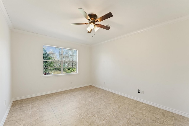 spare room featuring baseboards, ornamental molding, and a ceiling fan