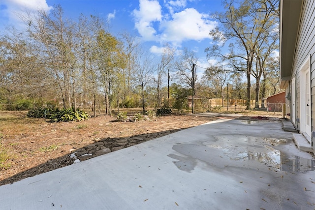 view of patio / terrace featuring fence