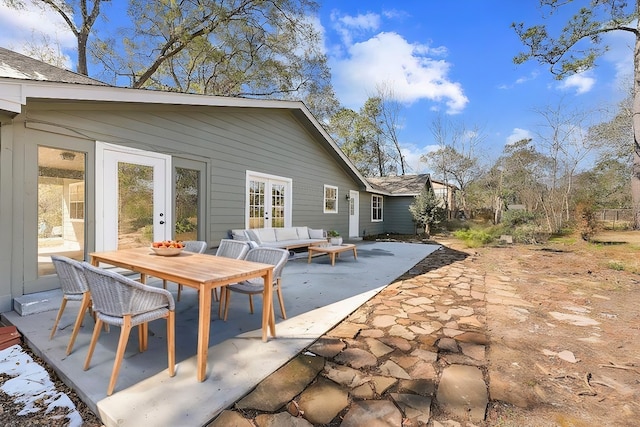 back of property featuring an outdoor hangout area, a patio, and french doors