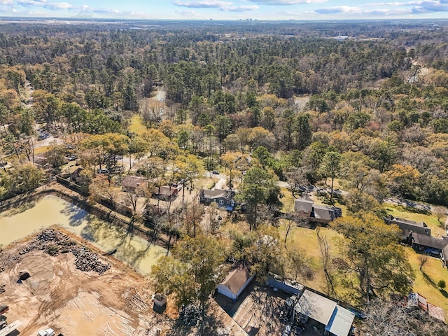 birds eye view of property with a wooded view