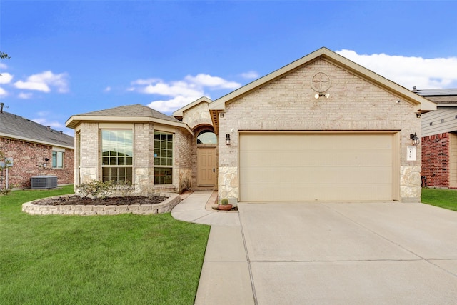 french country inspired facade with a garage, a front yard, and central AC unit