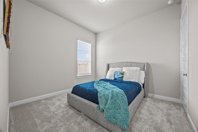 bedroom with light colored carpet