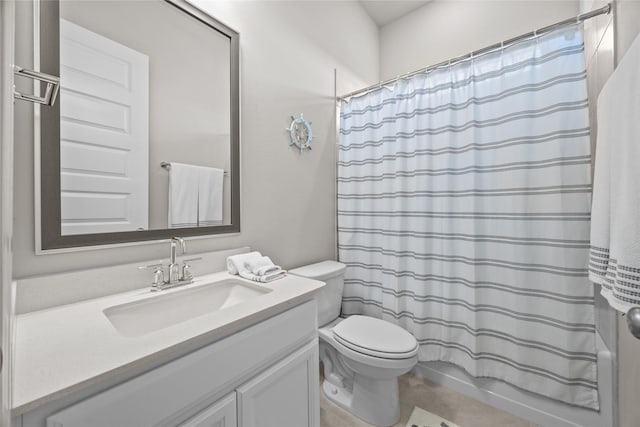 full bathroom with shower / tub combo, vanity, toilet, and tile patterned flooring