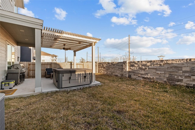 view of yard featuring a pergola, a patio area, and a hot tub