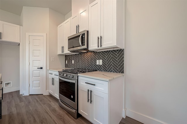 kitchen with white cabinetry and stainless steel appliances