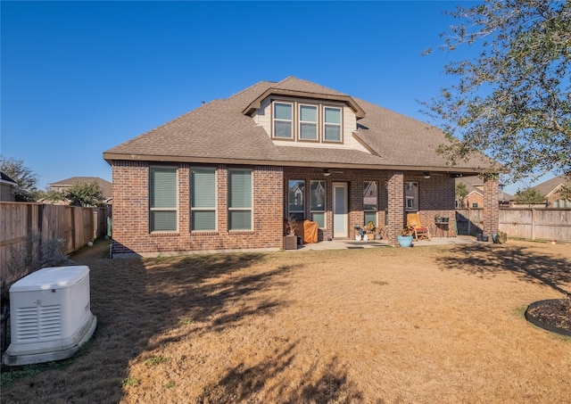 rear view of property with a patio area and a lawn