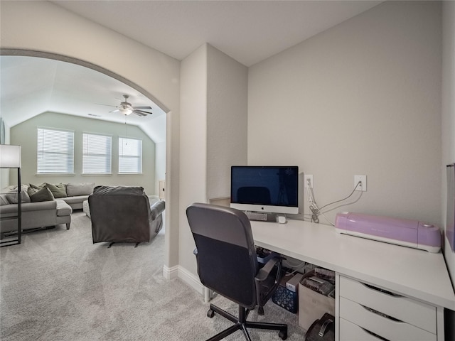 carpeted office featuring vaulted ceiling and ceiling fan