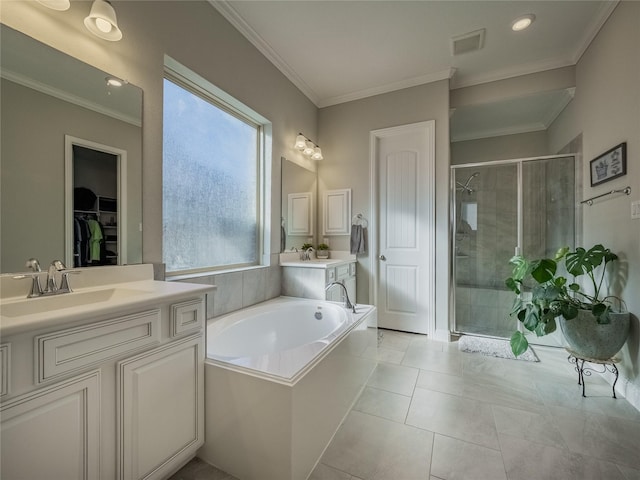 bathroom with crown molding, vanity, plus walk in shower, and tile patterned flooring