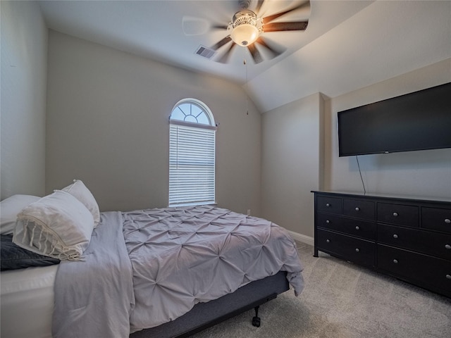 carpeted bedroom featuring ceiling fan and vaulted ceiling