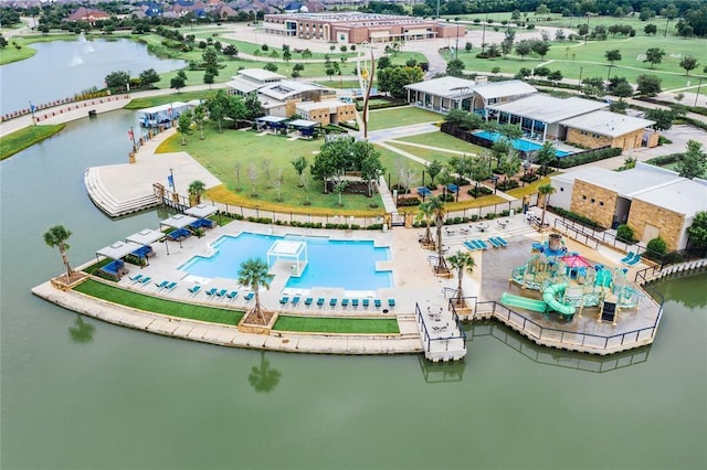 birds eye view of property with a water view