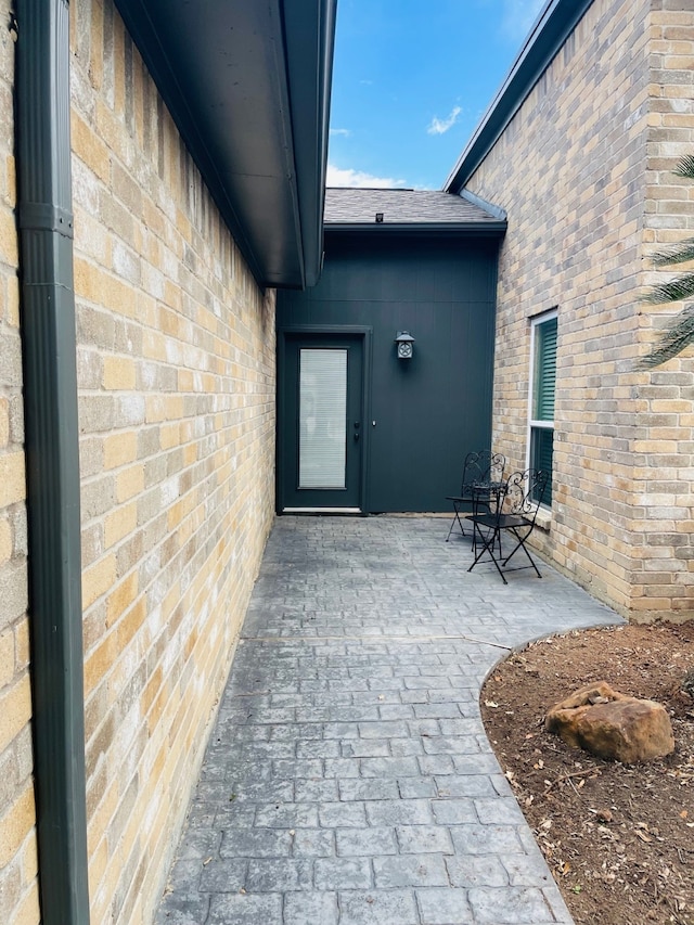 doorway to property with a patio