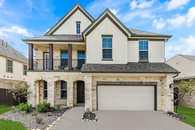 view of front of home featuring a balcony and a garage